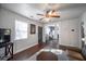 Bright living room with hardwood floors, neutral paint, and a modern ceiling fan at 1475 Elizabeth Ln, Atlanta, GA 30344