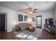 Comfortable living room showcasing a neutral color palette, wood floors, and contemporary decor at 1475 Elizabeth Ln, Atlanta, GA 30344