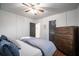 Cozy main bedroom with neutral walls, wood floors, and a large dresser for ample storage at 1475 Elizabeth Ln, Atlanta, GA 30344