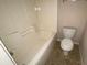 Clean bathroom featuring a bathtub, shower, and toilet at 304 Klinetop Dr, Mcdonough, GA 30253