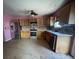 A kitchen featuring stainless steel appliances, wood cabinets, and tile floors at 304 Klinetop Dr, Mcdonough, GA 30253