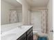 Functional bathroom with a double vanity, shower, and tub at 5015 Rapahoe Trl, Atlanta, GA 30349