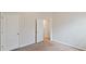 Clean, carpeted bedroom with closet and neutral paint, ready for personalization at 5015 Rapahoe Trl, Atlanta, GA 30349