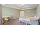 Spacious bedroom with plush carpeting, tray ceilings, and playful decor at 5015 Rapahoe Trl, Atlanta, GA 30349