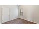 Bedroom with neutral walls and carpet, door and window with blinds at 5015 Rapahoe Trl, Atlanta, GA 30349