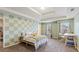 Bedroom features tray ceiling, carpet, and natural light from two windows at 5015 Rapahoe Trl, Atlanta, GA 30349