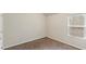 A bright carpeted bedroom with a window lets in natural light at 5015 Rapahoe Trl, Atlanta, GA 30349