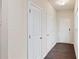 Hallway with hardwood floors and white doors and trim at 5015 Rapahoe Trl, Atlanta, GA 30349