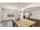 Kitchen with granite island, stainless sink and archway leading to living room at 5015 Rapahoe Trl, Atlanta, GA 30349