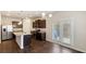Bright kitchen with stainless steel appliances, dark cabinetry, and granite countertops at 5015 Rapahoe Trl, Atlanta, GA 30349