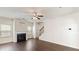 Living space featuring a fireplace, dark floors, and a staircase to the second level at 5015 Rapahoe Trl, Atlanta, GA 30349