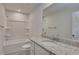 Modern bathroom with a granite countertop and a shower-tub with bright neutral colors at 718 Ocmulgee Crossing, Locust Grove, GA 30248