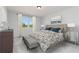 Bedroom featuring a bed with upholstered headboard, bench, and two dressers at 718 Ocmulgee Crossing, Locust Grove, GA 30248