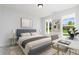 Cozy bedroom showcasing natural light and decor that creates a peaceful retreat at 718 Ocmulgee Crossing, Locust Grove, GA 30248