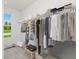 Walk-in closet with shelving and hanging space, providing ample storage at 718 Ocmulgee Crossing, Locust Grove, GA 30248