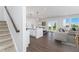 Open floor plan featuring the kitchen, dining area, and living room with lots of natural light at 718 Ocmulgee Crossing, Locust Grove, GA 30248