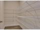 Walk-in pantry with multiple wire shelves for ample storage space at 718 Ocmulgee Crossing, Locust Grove, GA 30248