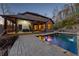 A well lit backyard featuring a refreshing pool and outdoor theater on the covered patio at 101 Bevil Ridge Se Rd, Emerson, GA 30137