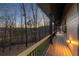 A cozy outdoor balcony overlooking a beautiful tree filled backyard, perfect for relaxation at 101 Bevil Ridge Se Rd, Emerson, GA 30137