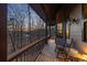 Inviting balcony with chairs offers a relaxing outdoor space with serene views of the surrounding trees at 101 Bevil Ridge Se Rd, Emerson, GA 30137