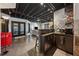 Open basement area with bar, kitchen appliances, living room and doors to backyard at 101 Bevil Ridge Se Rd, Emerson, GA 30137