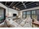 Finished basement featuring large windows, open ceiling, with stylish lounge furniture and a large television at 101 Bevil Ridge Se Rd, Emerson, GA 30137