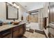 Bathroom featuring modern fixtures, a vessel sink, granite countertops, and tub-shower combination at 101 Bevil Ridge Se Rd, Emerson, GA 30137