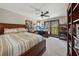 Bedroom featuring a large window with a view, ceiling fan, and a workspace with two monitors at 101 Bevil Ridge Se Rd, Emerson, GA 30137