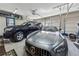 Garage showcasing modern vehicles with ample space, shelving, and natural light from garage doors at 101 Bevil Ridge Se Rd, Emerson, GA 30137
