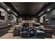 Spacious home theater with leather seating, movie decor, tiered seating and a dark color scheme at 101 Bevil Ridge Se Rd, Emerson, GA 30137