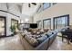 Bright living room with stone fireplace, large windows, and neutral décor, creating a cozy, inviting atmosphere at 101 Bevil Ridge Se Rd, Emerson, GA 30137