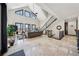 Light-filled living room with high ceilings, modern staircase, and scenic views at 101 Bevil Ridge Se Rd, Emerson, GA 30137