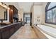 This main bath is complete with a double vanity, garden tub, and walk-in shower at 101 Bevil Ridge Se Rd, Emerson, GA 30137