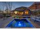 Backyard pool and jacuzzi combination features cozy patio and relaxing views, perfect for entertaining or relaxing at 101 Bevil Ridge Se Rd, Emerson, GA 30137