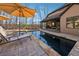 Pool with stone design, sun umbrellas and backyard view on a sunny day at 101 Bevil Ridge Se Rd, Emerson, GA 30137