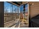 Covered porch with a beverage refrigerator, wood flooring and railing, offering a relaxing outdoor experience at 101 Bevil Ridge Se Rd, Emerson, GA 30137