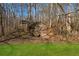 A unique stone structure adds character to the yard's landscape, with a home nestled in the background at 101 Bevil Ridge Se Rd, Emerson, GA 30137