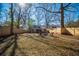 Expansive backyard with fire pit seating and wooden privacy fence, perfect for outdoor enjoyment at 1475 Elizabeth Ln, East Point, GA 30344