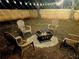 Inviting backyard with a charming fire pit and chairs, perfect for outdoor gatherings at 1475 Elizabeth Ln, East Point, GA 30344