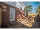 Cozy brick home features a backyard with stone pavers and a metal security door at 1475 Elizabeth Ln, East Point, GA 30344