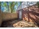 Cozy brick home features a backyard with stone pavers and a newly installed wooden fence at 1475 Elizabeth Ln, East Point, GA 30344