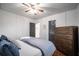 Cozy bedroom with hardwood floors, a comfortable bed, and a modern dresser at 1475 Elizabeth Ln, East Point, GA 30344