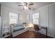 Bright bedroom featuring a daybed, desk area, and ample natural light at 1475 Elizabeth Ln, East Point, GA 30344