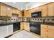 Well-equipped kitchen featuring modern appliances, wooden cabinets, stylish backsplash, and efficient layout at 198 Ponce De Leon Ne Ave # 2A, Atlanta, GA 30308