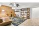 Stylish living space with a comfortable couch, patterned rug, decorative shelving, and bright, inviting lighting at 198 Ponce De Leon Ne Ave # 2A, Atlanta, GA 30308
