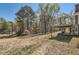 Large backyard with trees and sunroom at 12142 Panhandle Rd, Hampton, GA 30228