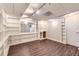 Finished basement with built-in shelving and wood-look flooring at 12142 Panhandle Rd, Hampton, GA 30228