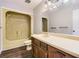 Bathroom with wood vanity, mirror, and yellow shower and tub combo at 12142 Panhandle Rd, Hampton, GA 30228