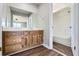 En suite bathroom with wood vanity, mirror, and a shower and tub combo at 12142 Panhandle Rd, Hampton, GA 30228