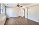 Spacious bedroom with wood-look flooring and neutral paint at 12142 Panhandle Rd, Hampton, GA 30228